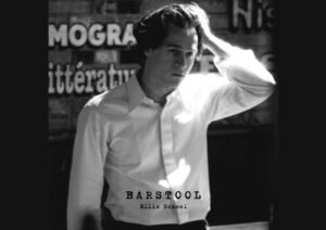 Ellis Schoel’s “Barstool” – A Haunting Reflection on Love and Loss