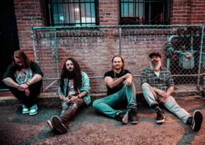 Stranded By Choice – ‘Marooned In Stone’: A Riff-Heavy Journey Through Time and Consciousness